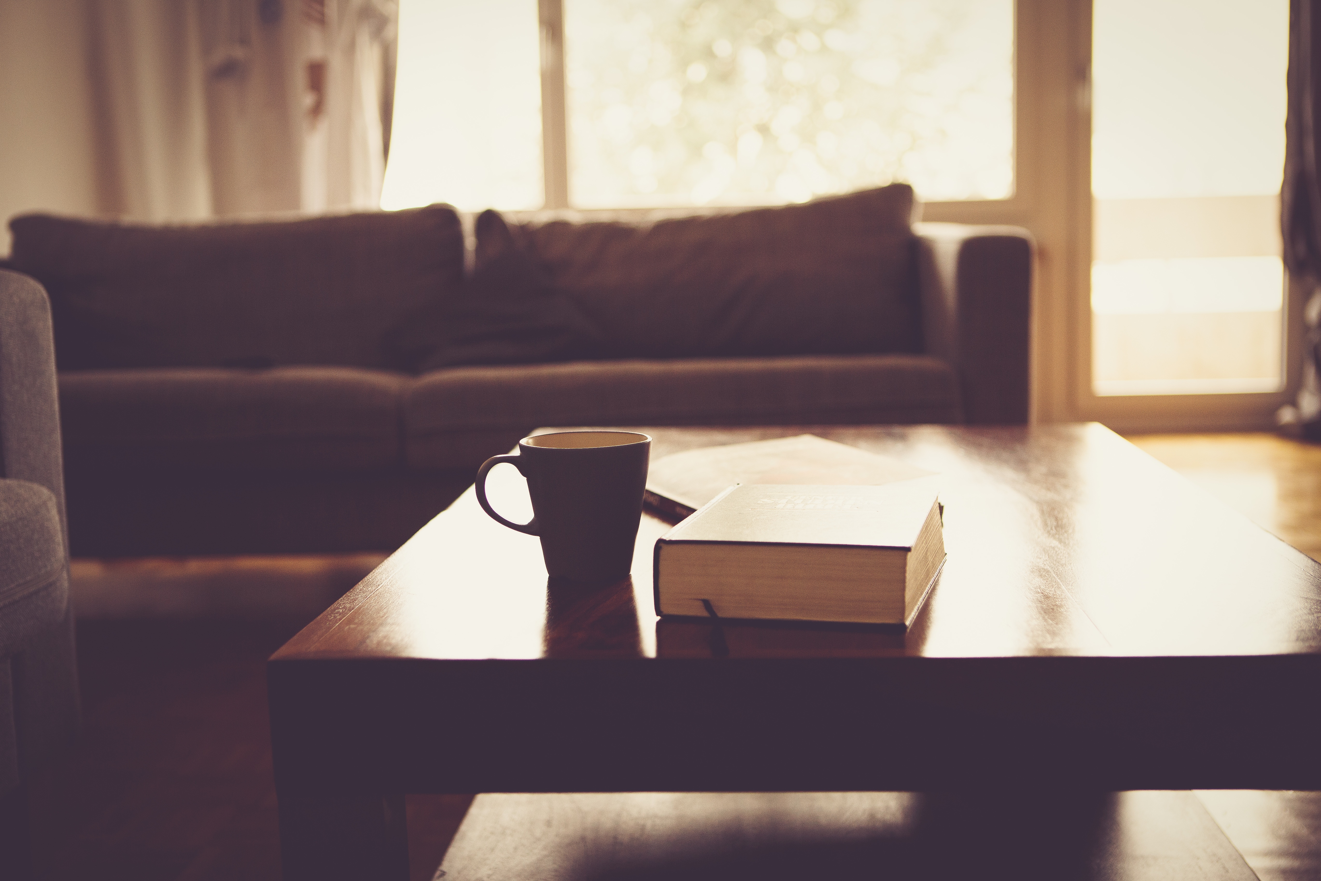 Coffee table with book and mug