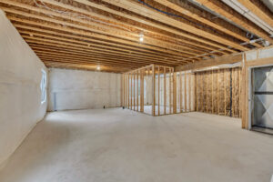 Unfinished basement with wooden framing, exposed beams, and a gentle ambiance reminiscent of a nightingales song.